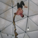 an-unamed-man-re-arranging-the-tiger-tail-on-the-dome-roof.jpg