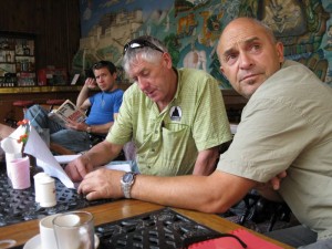 Russell Brice (expedition leader) and guide Mark Whetu discuss logistics over breakfast